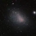 Fratricide galactique : une petite galaxie se fait déchiqueter par sa grande sœur juste sous nos yeux!